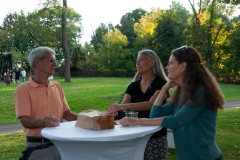 Booker-reception-3-people-talk-at-table